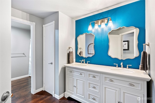 bathroom with vanity and hardwood / wood-style flooring