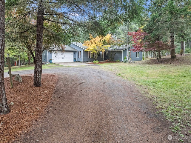 view of front of house with a front lawn and a garage