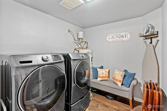 laundry area featuring hardwood / wood-style flooring and washer and clothes dryer