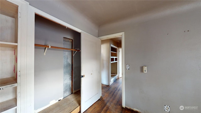 unfurnished bedroom featuring dark hardwood / wood-style floors