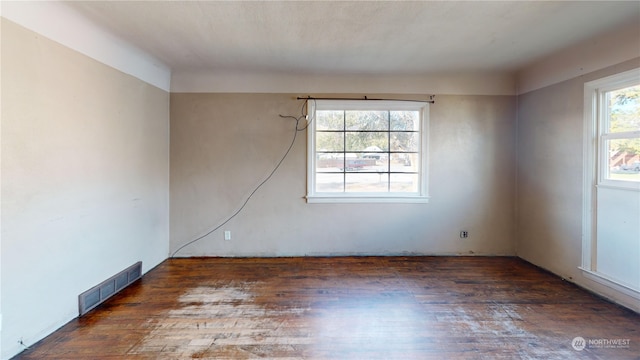 empty room with dark hardwood / wood-style floors