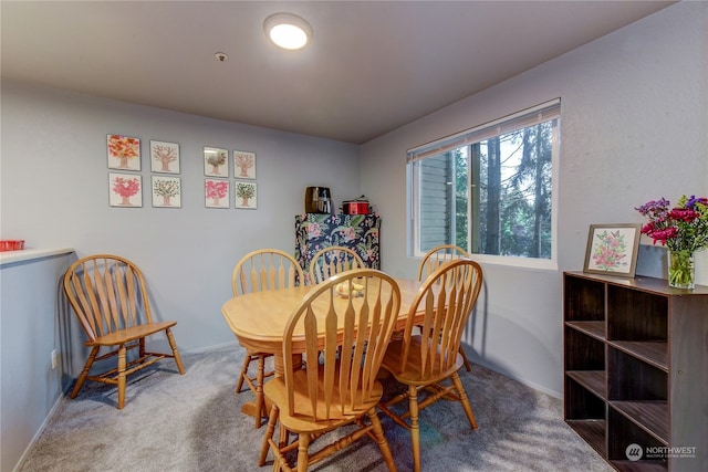 view of carpeted dining space