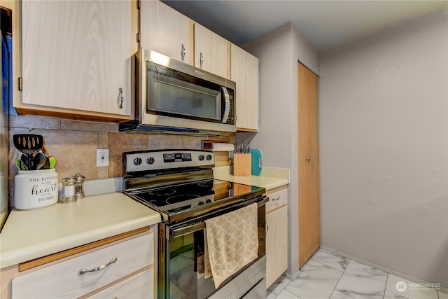 kitchen with appliances with stainless steel finishes, decorative backsplash, and light brown cabinetry