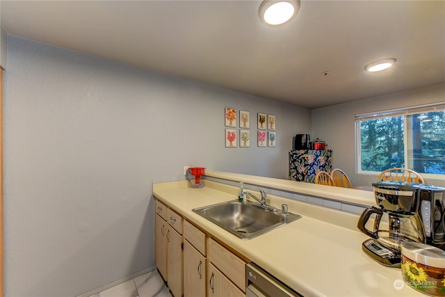 kitchen with sink, light brown cabinets, kitchen peninsula, and light tile patterned floors