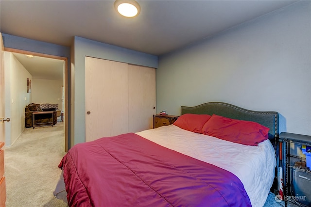 carpeted bedroom with a closet