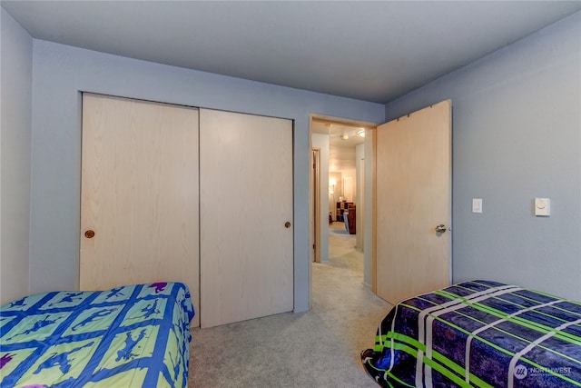 carpeted bedroom featuring a closet