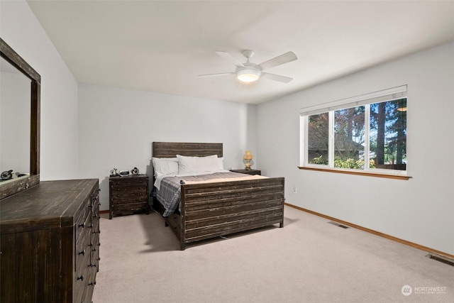 bedroom featuring ceiling fan and light carpet