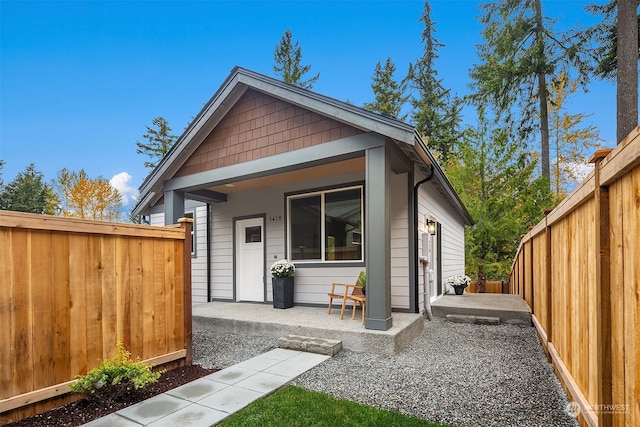 back of property with a patio