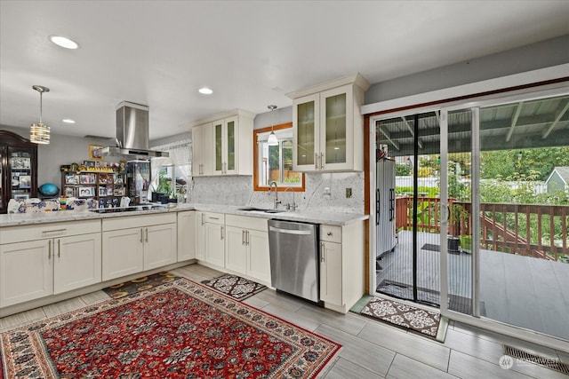 kitchen featuring sink, dishwasher, island range hood, and plenty of natural light