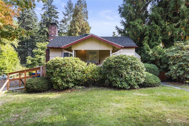 exterior space featuring a front lawn