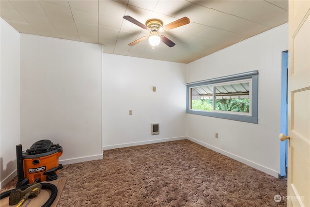 empty room with ceiling fan and carpet flooring