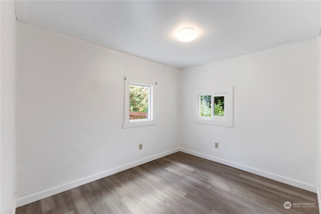 spare room featuring dark hardwood / wood-style floors