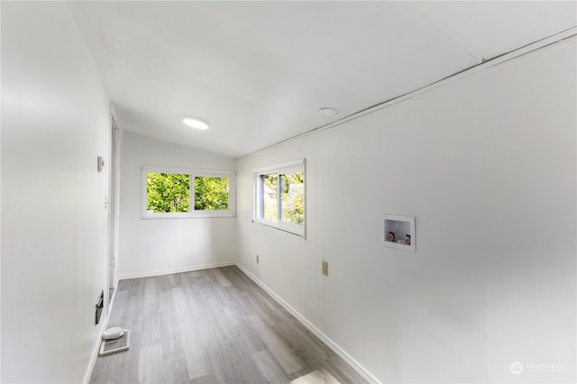 clothes washing area featuring washer hookup and light hardwood / wood-style floors