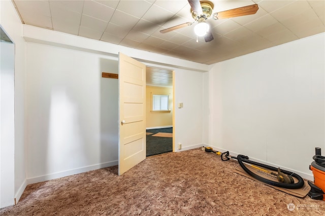 interior space featuring carpet flooring and ceiling fan