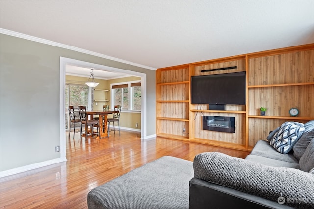 living room featuring ornamental molding and hardwood / wood-style floors