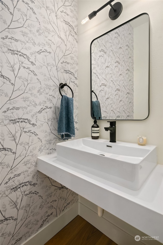 bathroom featuring hardwood / wood-style flooring and sink