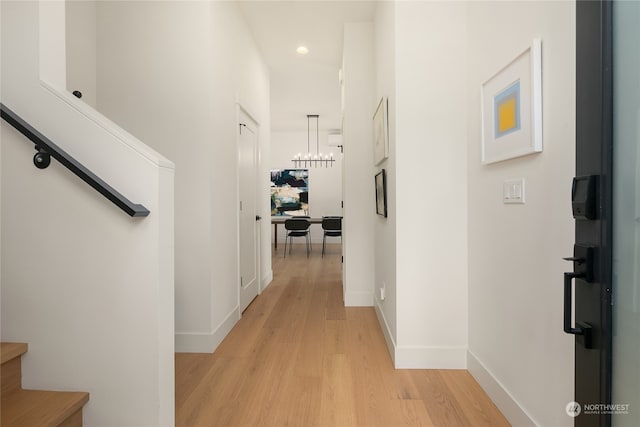 hall with light hardwood / wood-style flooring