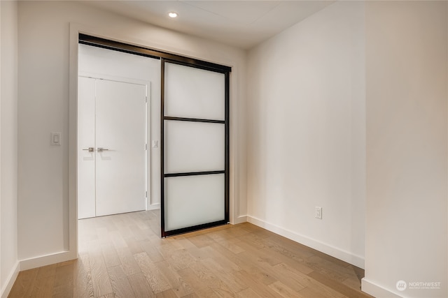 unfurnished bedroom featuring light wood-type flooring