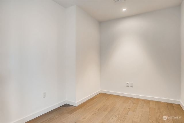 spare room with light wood-type flooring