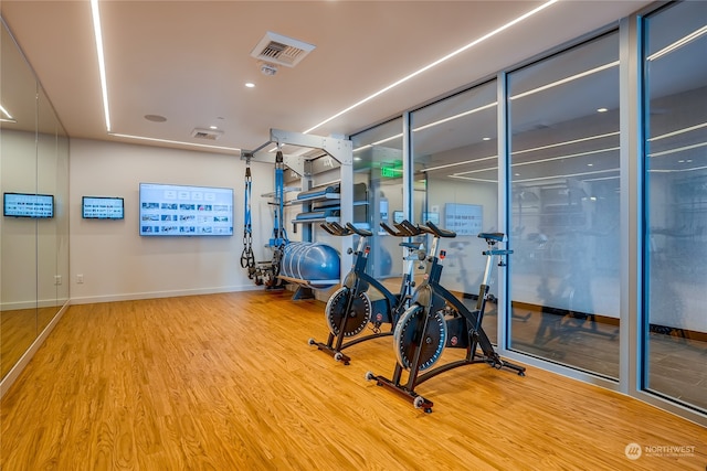 workout area featuring hardwood / wood-style floors