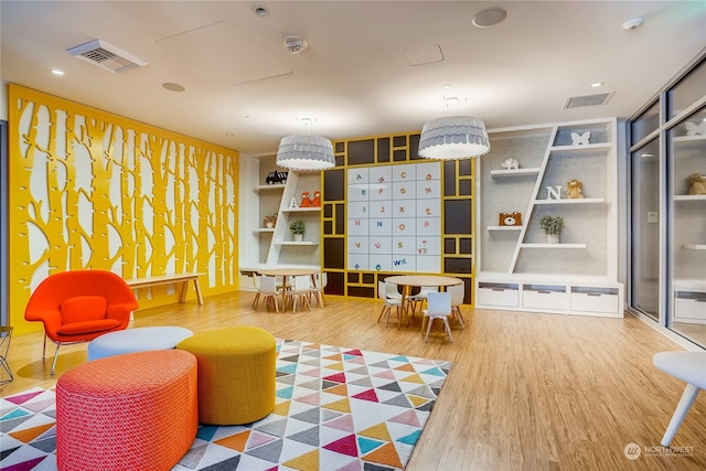 recreation room with hardwood / wood-style flooring