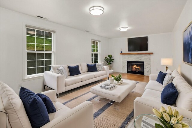 27705 23rd Ave S, Federal Way, WA 98003 - living area with a fireplace, visible vents, and wood finished floors