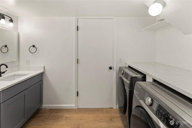 27705 23rd Ave S, Federal Way, WA 98003 - laundry area featuring a sink, separate washer and dryer, light wood-style flooring, and laundry area