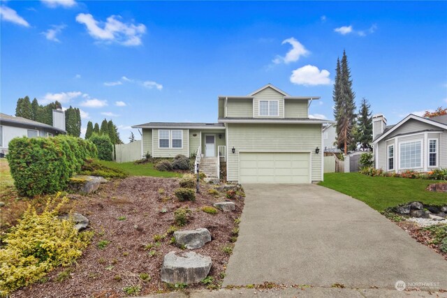 27705 23rd Ave S, Federal Way, WA 98003 - view of front of property featuring concrete driveway, a front lawn, a garage, and fence