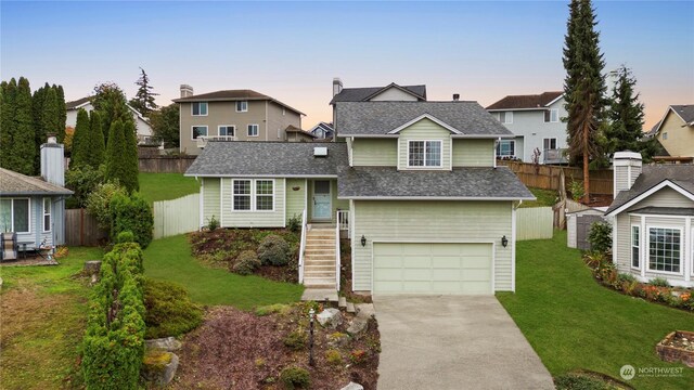 27705 23rd Ave S, Federal Way, WA 98003 - view of front of home with a garage, fence, a shingled roof, a yard, and driveway