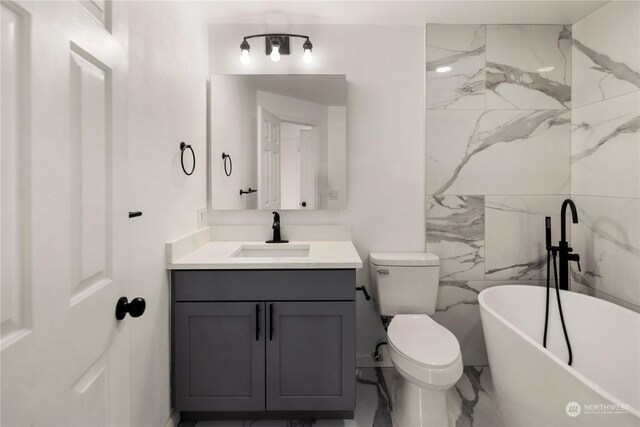 27705 23rd Ave S, Federal Way, WA 98003 - full bath featuring vanity, toilet, marble finish floor, and a freestanding tub