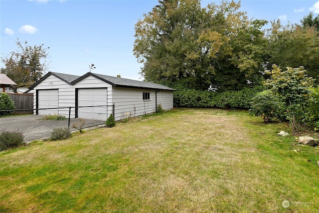 view of yard with an outbuilding and a garage