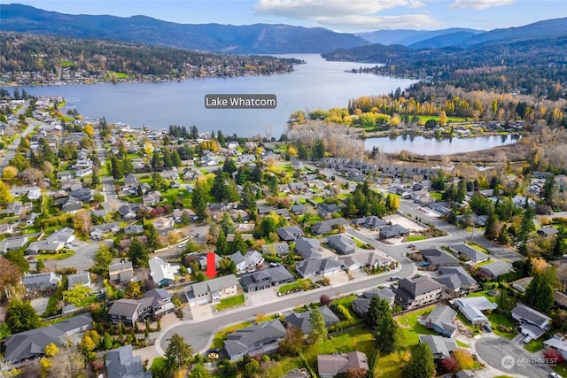 drone / aerial view with a water and mountain view