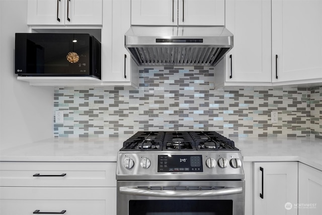 kitchen with white cabinets, range hood, backsplash, and stainless steel gas range