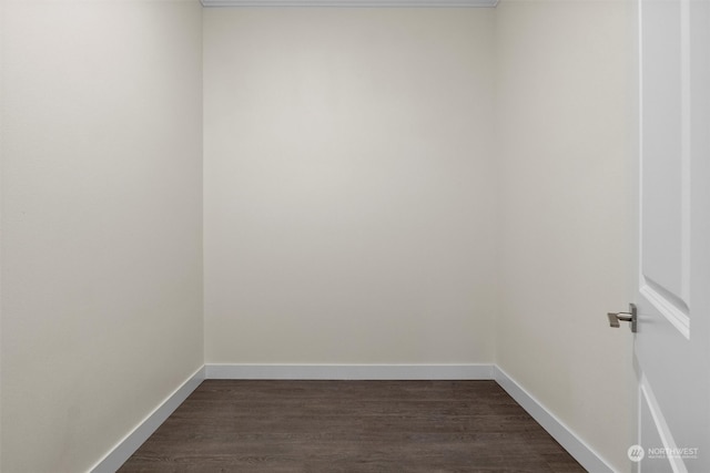 spare room featuring dark wood-type flooring