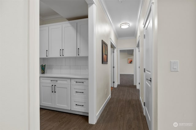 corridor with crown molding and dark hardwood / wood-style floors