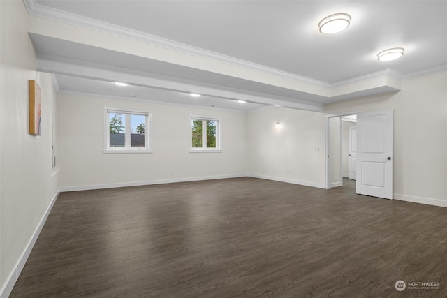 empty room with dark wood-type flooring and ornamental molding