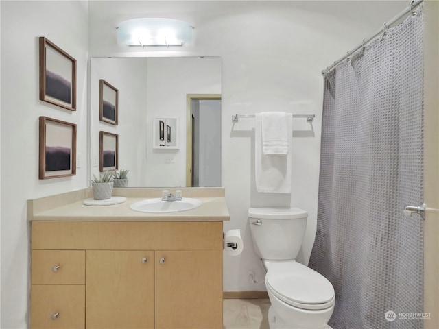 bathroom featuring vanity, toilet, and a shower with shower curtain