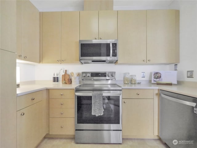 kitchen with appliances with stainless steel finishes and light brown cabinets