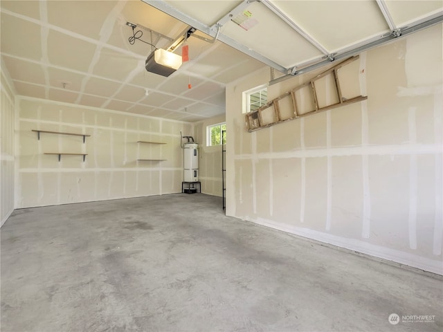 garage featuring a garage door opener and electric water heater