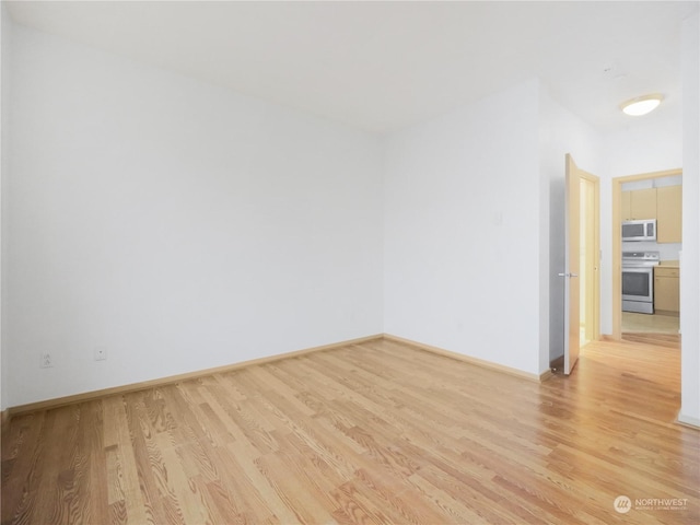 unfurnished room featuring light wood-type flooring