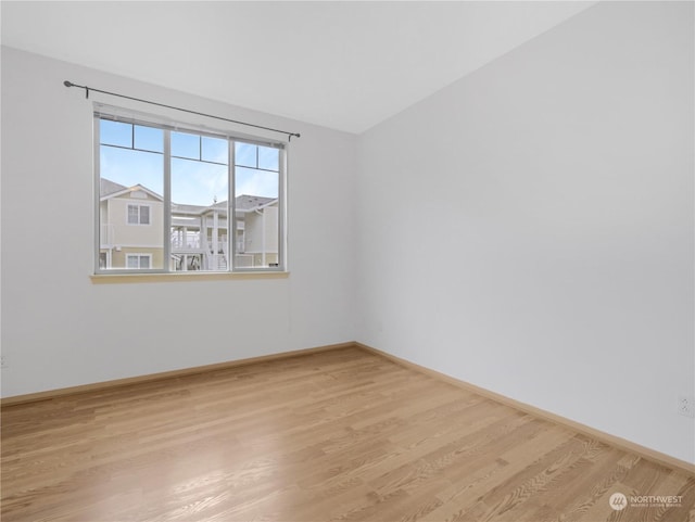 spare room featuring light wood-type flooring