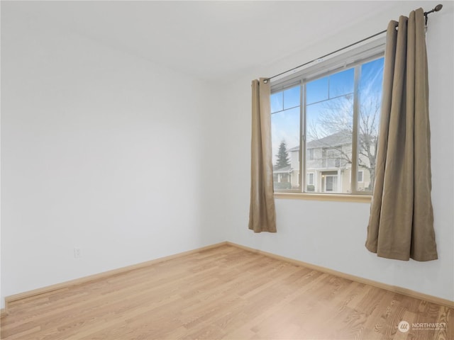 unfurnished room with light hardwood / wood-style floors