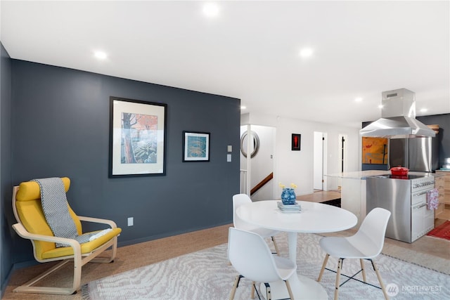 dining space with baseboards and recessed lighting