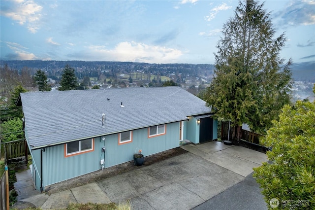 view of front of house with roof with shingles