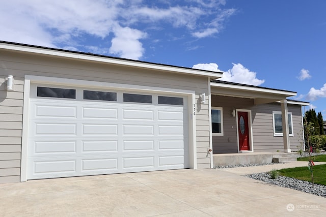 ranch-style house featuring a garage