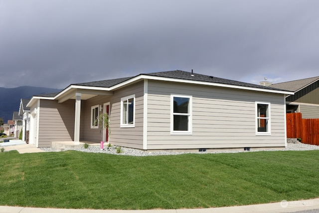 view of property exterior with a lawn