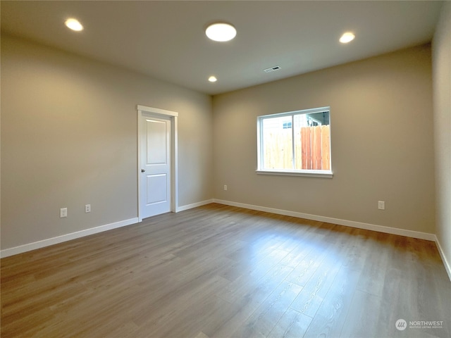 unfurnished room featuring light wood-type flooring