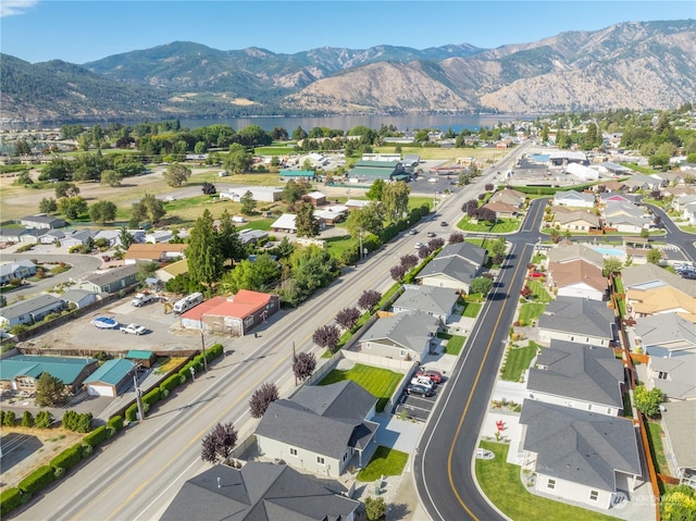 birds eye view of property featuring a water and mountain view