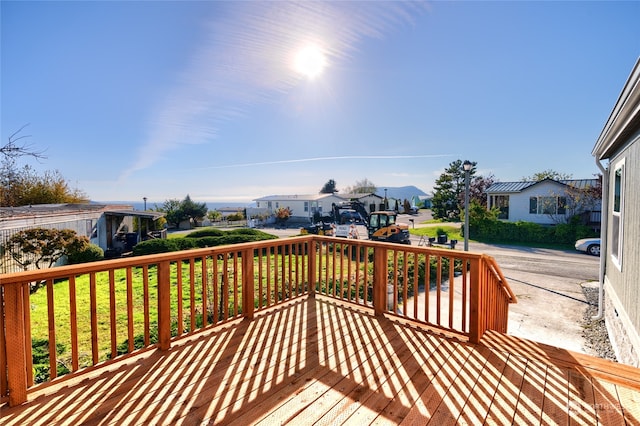 wooden terrace with a yard