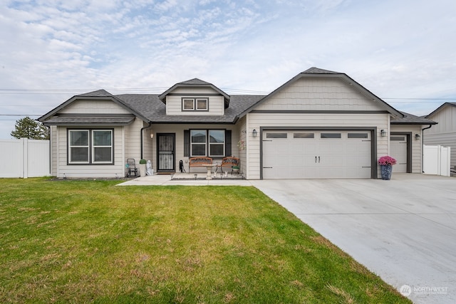 view of front facade with a front yard and a garage